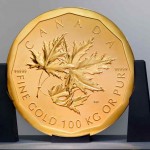 Back of the world's largest gold coin featuring three maple leaves