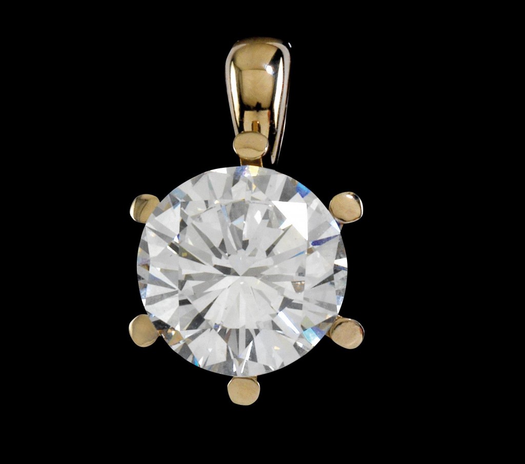 A solitaire brilliant diamond pendant in a white gold setting. The price estimate is €100,000 - €150,00.