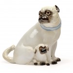 Lot 901. Female pug with puppy wearing a light blue collar with golden bells, Meißen,