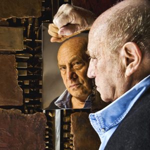 7154349 Arnaldo Pomodoro is reflected in one of his bronze works in his studio of via vigevano (Navigli) in Milan, 2009 (photo) by Pomodoro, Arnaldo (b.1926); Private Collection; (add.info.: Arnaldo Pomodoro is an Italian sculptor and goldsmith. He is considered one of the greatest contemporary Italian sculptors, well known and appreciated also abroad - Milan, Italy 2009); © Salvo Galano. All rights reserved 2023.<br /> Please note: This photograph requires additional permission prior to use. If you wish to reproduce this image, please contact Bridgeman Images and we will manage the permission request on your behalf. 